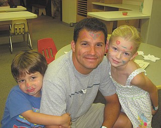 Tony Perry of Salem joins in the fun with his kids, Abby and Anthony.