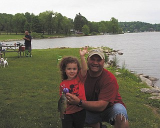 David LaRosa of Boardman took his daughter, Zoe, on her first fishing trip at Guilford Lake.