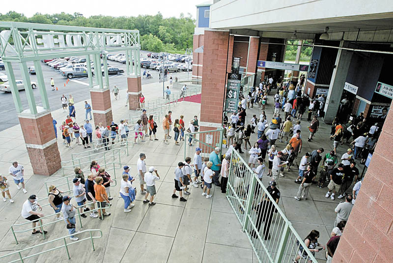 A crowd of Mahoning Valley Scrappers’ fans streams through the gates of Eastwood Field in Niles for the team’s home opener against the Auburn Doubledays of Auburn, N.Y.
