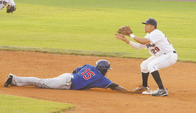 Aaron Fields (29) of the Mahoning Valley Scrappers waits for the ball as Markus Brisker of the Auburn
Doubledays slides safely back to second base during Wednesday’s game at Eastwood Field.