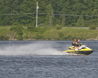 ROBERT K. YOSAY | THE VINDICATOR..IN FOCUS .Hot times as a Jet ski skims across Lake Milton ..-30--