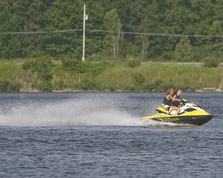 ROBERT K. YOSAY | THE VINDICATOR..IN FOCUS .Hot times as a Jet ski skims  across Lake Milton ..-30--