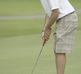 ROBERT K. YOSAY | THE VINDICATOR...Salem Hills GC- Hole #4 Light green Shirt is Ben Broderick- Yellow Shirt Tan shorts Chad Hanysh and Yellow Shirt and Dark Shors is John Clacko -30--
