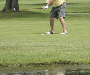 ROBERT K. YOSAY | THE VINDICATOR...Salem Hills GC- Hole #4 Light green Shirt is Ben Broderick- Yellow Shirt Tan shorts Chad Hanysh and Yellow Shirt and Dark Shors is John Clacko -30--