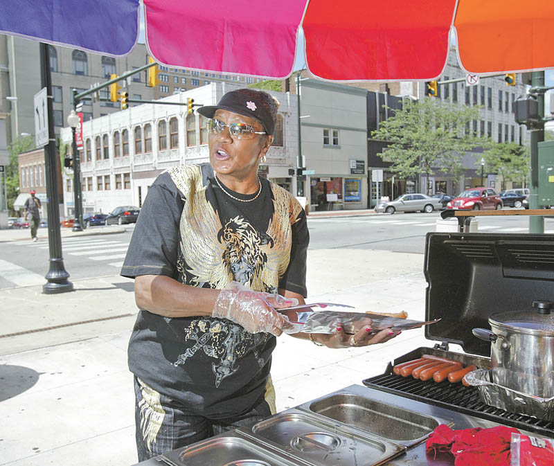 Blanche Silva, who runs a hot-dog stand in downtown Youngstown, would be prohibited from operating the business when a new law goes into effect Sept. 13. Here she operates at West Federal and North Phelps streets.