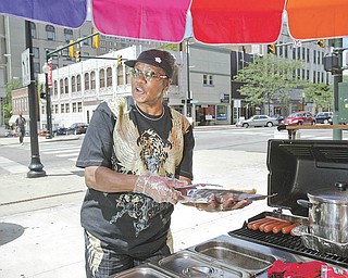 Blanche Silva, who runs a hot-dog stand in downtown Youngstown, would be prohibited from operating the business when a new law goes into effect Sept. 13. Here she operates at West Federal and North Phelps streets.