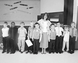 Students are upgraded
Members of the kindergarten class at St. Patrick School in Hubbard were honored by family, friends, staff and fellow students during a graduation ceremony recently at the school. Each student was escorted by an eighth-grade buddy who presented each with a book containing a story about things they learned about their kindergarten friend during the year. The graduating youngsters were joined by their teacher, Mrs. Barbara Bond, as they lined up to receive their diplomas and to sing special songs at the event. A reception followed the ceremony.