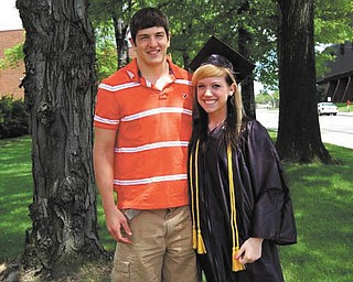 Derek Gustovich of Mineral Ridge share the moment with graduate Kara Cetar of Niles..
