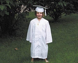 Olivia Rossi of Austintown is shown at kindergarten graduation from Ursuline Preschool and Kindergarten.