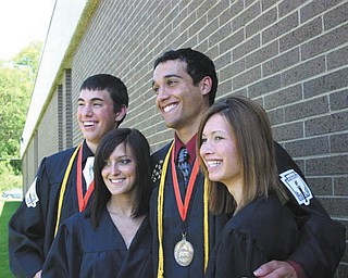 These four Mineral Ridge grads who live in the same neighborhood pose together on graduation day: Kyle Borton, Kristen Basista, Anthony Pannunzio and Tanya Evans.
