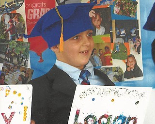Logan Green from Boardman graduated from preschool at Discover My World.