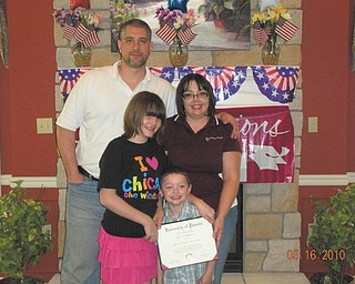Julie Blakeman of Boardman received her masterÕs in business administration from the University of Phoenix. With her are her husband, Dan, and her children, Rio Blakeman and Brittany Morris.