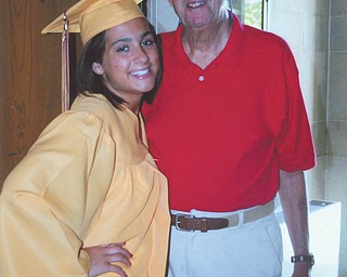 Lauren Stevens, a member of this yearÕs graduating class at Liberty High School, is standing with her grandfather, Harold Sacherman, inside the entrance of Stambaugh Auditorium.