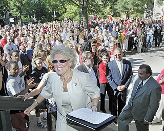 Cynthia E. Anderson, Youngstown State University's new president, leads the way up the steps of Tod Hall after inviting about 500 well-wishers inside for refreshments as she began her first day on the job Thursday. The crowd gathered in front of Tod Hall at 9 a.m. to greet her.