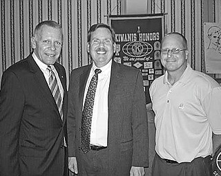 Laying down the law: “Essential Estate Planning Documents” was the theme of Jeffrey D. Heintz, center, an estate planning and probate law attorney with Manchester, Bennett, Powers & Ullman, when he spoke at the June 18 meeting of the Kiwanis Club of Youngstown at the YMCA. His talk covered durable powers of attorney, wills and trusts and how these legal documents play an important role in two phases of life, disability and death. Joining Heintz after his presentation were, from left, Chris McCarty, Kiwanis Club president, and Robert Gardner, CPA and financial adviser with the Bennett/Gardner Group, Butler Wick Division of Stifel Nicolaus & Co., program sponsor.