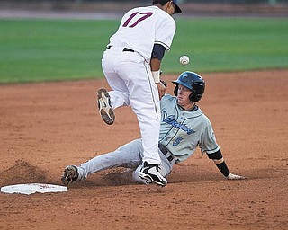 Geoffrey Hauschild|The Vindicator .Vermont Lake Monster, Blake Kelso, arrives safely at second base after Mahoning Valley Scrapper, Kevin Fontanez, tries to gain control of a ball thrown his way during the fifth inning at Eastwood Field on Thursday evening.