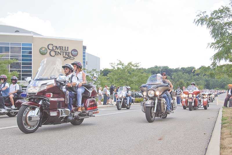 Riders take off in the eighth annual Our Fallen Offi cers Memorial Run in memory of Youngstown police offi cer Michael Hartzell and other police offi cers in the county and in Steubenville who were killed in the line of duty over the past 119 years.
