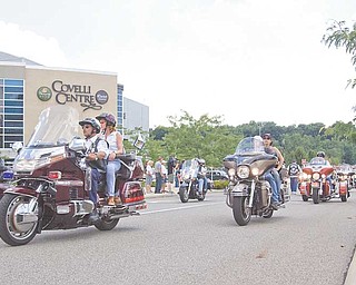 Riders take off in the eighth annual Our Fallen Offi cers Memorial Run in memory of Youngstown police offi cer Michael Hartzell and other police offi cers in the county and in Steubenville who were killed in the line of duty over the past 119 years.