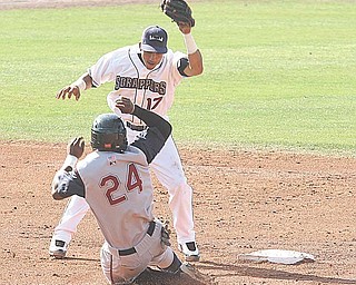 Kevin Fontanez (17) gets set to apply the tag on Burt Reynolds during their game Sunday afternoon in Niles.