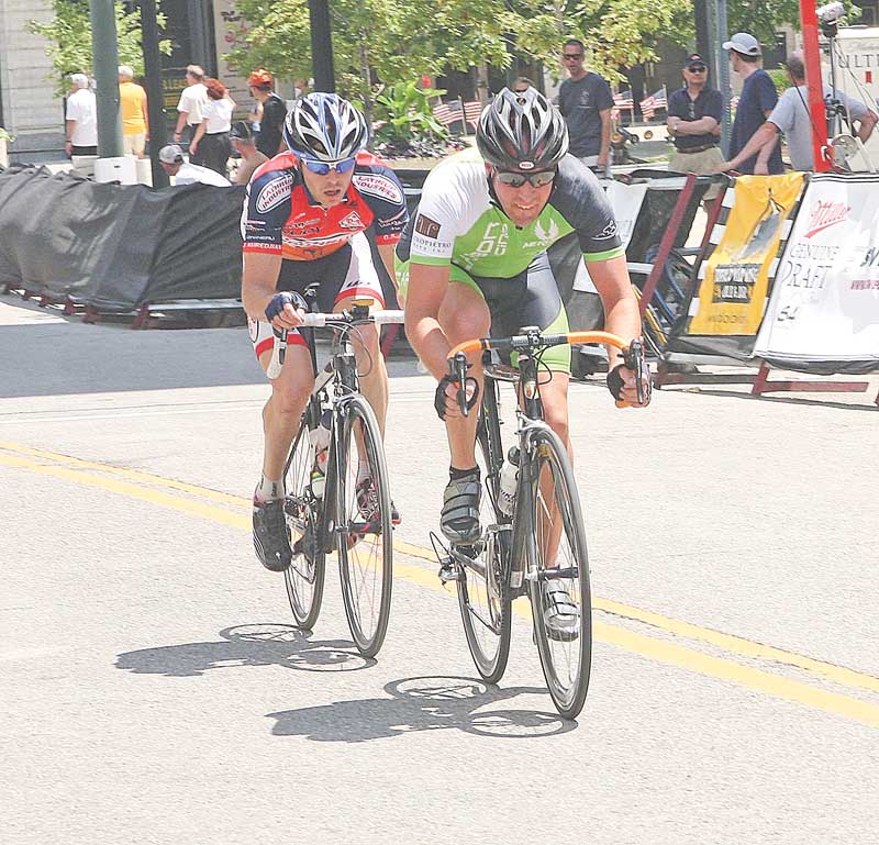 BIKE RACE - The leaders draft down the straight away downtown Youngstown Sunday afternoon. - Special to The Vindicator/Nick Mays