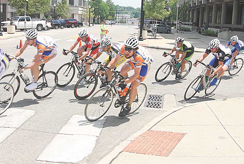 BIKE RACE - Racers taking a turn at 30 mph downtown Youngstown Sunday afternoon. - Special to The Vindicator/Nick Mays