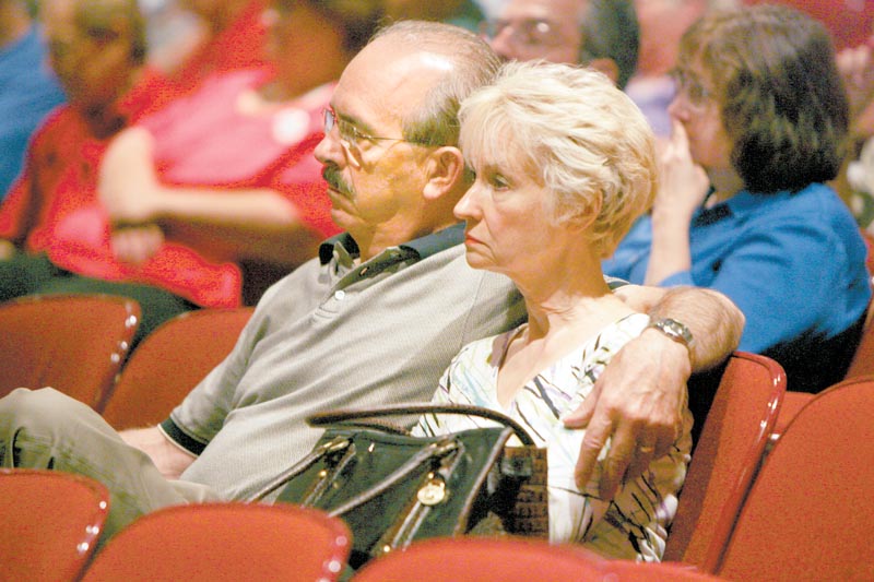 Stephen and Dianna Ferro of Warren listen to testimony given Tuesday at a field hearing at Canfield High School about cuts made to Delphi salaried retireesÕ pension benefits..