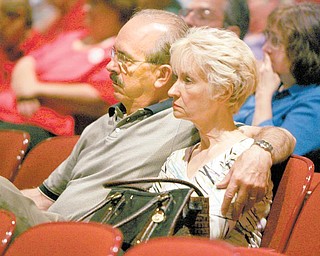 Stephen and Dianna Ferro of Warren listen to testimony given Tuesday at a field hearing at Canfield High School about cuts made to Delphi salaried retireesÕ pension benefits..