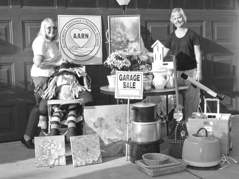 Alzheimer’s Assistance and Referral Network is having a garage sale from 9 a.m. to 3 p.m. Thursday and Friday, and from 9 a.m. to 11 a.m. July 24 at Western Reserve United Methodist Church, 4580 Canfield Road, Canfield. Arranging some of the items to be featured at the sale are, at left, Dorothy Barto, director of AARN, and Mary Kay Kollat, volunteer coordinator. Proceeds will benefit the network. Donations of clean, salable items will be accepted from 9 a.m. to 3 p.m. Tuesday and Wednesday at the church.
