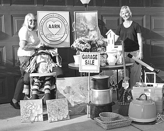 Alzheimer’s Assistance and Referral Network is having a garage sale from 9 a.m. to 3 p.m. Thursday and Friday, and from 9 a.m. to 11 a.m. July 24 at Western Reserve United Methodist Church, 4580 Canfield Road, Canfield. Arranging some of the items to be featured at the sale are, at left, Dorothy Barto, director of AARN, and Mary Kay Kollat, volunteer coordinator. Proceeds will benefit the network. Donations of clean, salable items will be accepted from 9 a.m. to 3 p.m. Tuesday and Wednesday at the church.