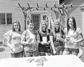 Book smart: Boardman-Poland Juniorettes members are having their third annual used book sale today from 9 a.m. to noon in the pavilion at Prince of Peace Evangelical Lutheran Church, 2985 Center Road, Poland. The group, which consists of girls ages 12-18 who are interested in volunteering in their communities, is sponsored by Boardman-Poland Junior Women. Among the members involved with today’s sale are, from left, Bianca Klase, Maddie Crish, Christina Ford, Kirstin Weaver and Johanna Dunkel.