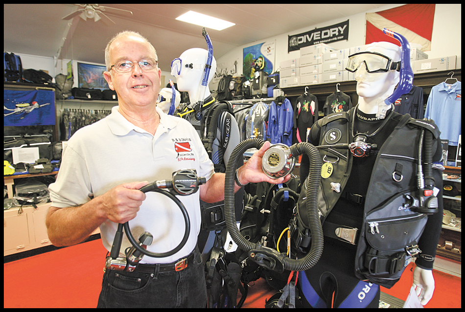 ROBERT K. YOSAY | THE VINDICATOR..Showing two types of breathing apparatus one from 50 years ago...Bob  Tyger --B & B Diving Specialties, a skin diving and scuba shop, is celebrating its 50th anniversary. The store used to be based in Youngstown. .-30