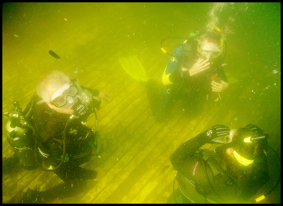 Geoffrey Hauschild|The VIndicator.(CLOCKWISE FROM LEFT) John Koczwara, of Poland, Aimee Campbell, of Union Twp., and Michele Ambrosia, of Edinburg, in Fox Quarry a lake created from an old limestone quarry B&B Diving in Hillsville PA.