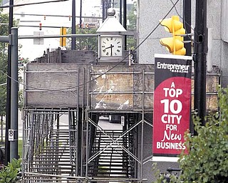 A  downtown Youngstown building still has scaffolding around it two years after it was erected. .