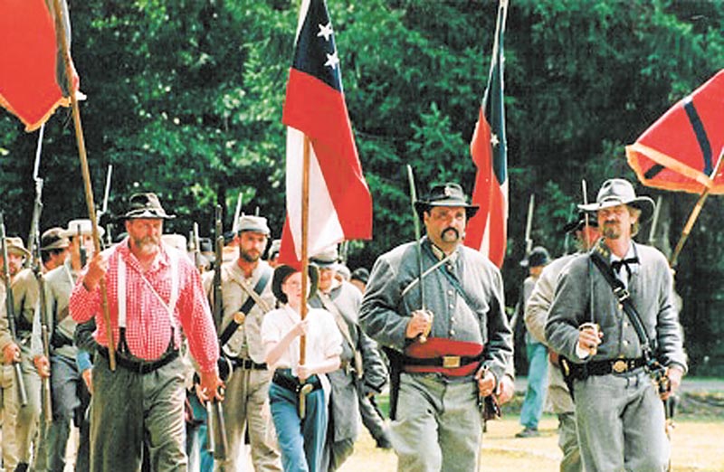 Confederate soldiers march to battle during a past Civil War reenactment at Argus Park in Canfield. Greg Anstrom, of Argus Lodge, said this reenactment is one of the largest in this area and will bring between 350 and 400 people in to take part as soldiers for the North and South. The event runs Saturday and Sunday at Argus Park off Shields Road, and gates open at 10 a.m..