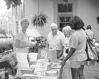 Browsing for bargains: Customers at the annual Upton Garage Sale, in downtown Warren, browse through the goods. The Upton Association and the Trumbull County Historical Society are sponsoring the sale, which is open to the public. It will take place from 9 a.m. to 4 p.m. Friday and Saturday. Tools, toys, furniture, antiques and household items are always available at the sales. Donations will be accepted from 9 a.m. to noon today and from 2-5 p.m. Thursday. The Harriet Taylor Upton Association, 380 Mahoning Ave. NW, Warren, operates Upton House. For more information phone 330-395-1840 or visit www.uptonhouse.org on the Web.