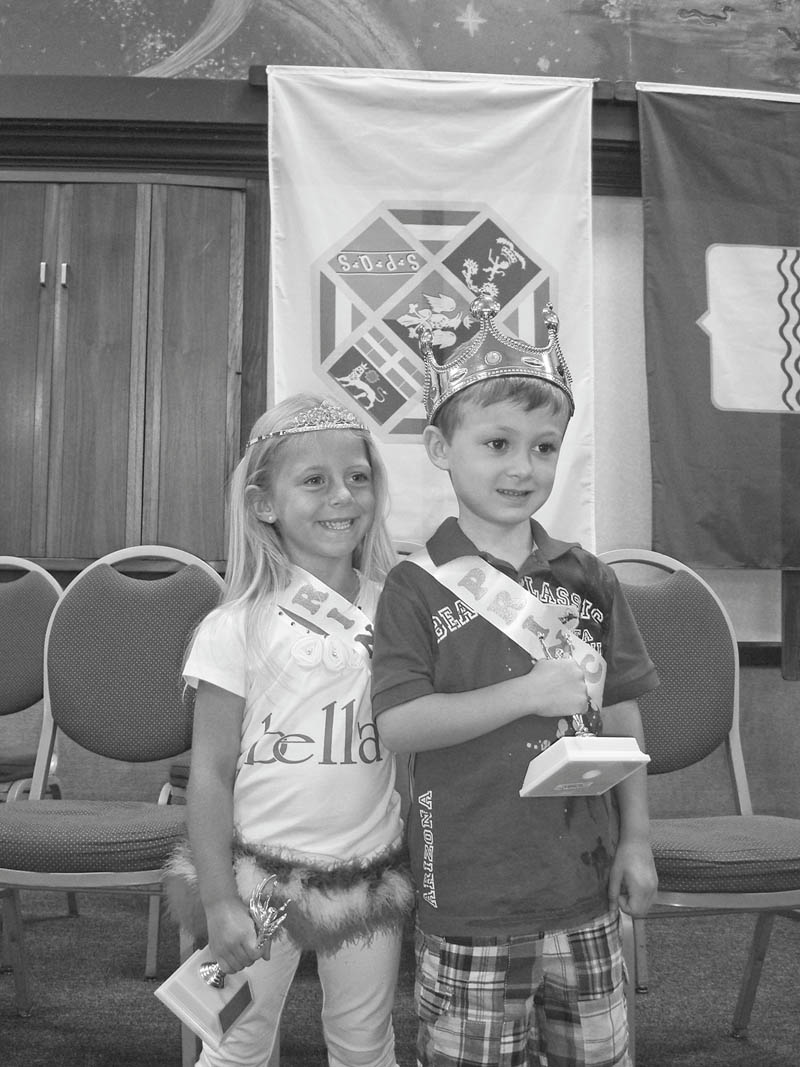 Royal couple honored: Wearing their crowns and holding trophies they received as they were crowned princess and prince at the 12th annual Our Lady of Mount Carmel Festival on July 22 at 343 Via Mount Carmel are, from left, Arianna DiFabio, 5, of Poland, and Anthony Mordocco, 4. of Canfield. The youngsters were among the 13 girls and 10 boys of Italian descent competing for the title this year. Last year Arianna’s sister, Brianna DiFabio, was honored as the princess  at the festival. 