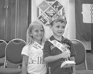 Royal couple honored: Wearing their crowns and holding trophies they received as they were crowned princess and prince at the 12th annual Our Lady of Mount Carmel Festival on July 22 at 343 Via Mount Carmel are, from left, Arianna DiFabio, 5, of Poland, and Anthony Mordocco, 4. of Canfield. The youngsters were among the 13 girls and 10 boys of Italian descent competing for the title this year. Last year Arianna’s sister, Brianna DiFabio, was honored as the princess  at the festival. 