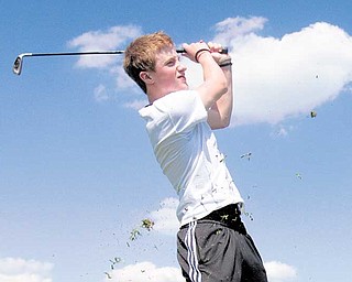 Dan Lageson, 18, of Howland, tees off at Parto’s Golf Learning Center. Lageson visited the course for the first time after coming across somecoupons.