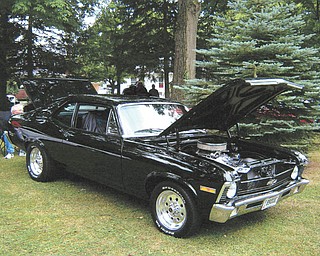 Senior Master Sgt. Frank Moss of Austintown is described by his wife, Diane, as "car crazy." Here he is shown behind his 1970 Chevy Nova during the Thunder in the Park Car Show in McDonald last year. She says he missed this summer season of car cruises because he's currently serving in Kirkuk, Iraq, with the 910th Unit out of the Youngstown Air Reserve Base in Vienna.