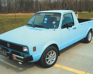This 1980 VW Rabbit pickup belongs to Walter Smith of Campbell. It has its original 4-cylinder 1.7 motor with after-market S&S headers and dual exhaust. He purchased the truck in November 2006, and it came from South Carolina, but it was made in Westmoreland, PA. These trucks were built in 1980-83. It was restored mechanically by Scofield's of Warren, and the body and paint work were done by Montgomery's Auto Body in Struthers. He says this is a rare 30-year-old VW that runs like new.