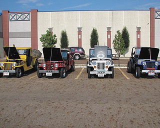 From left are: yellow 1953 CJ3B Jeep truck owned by Clarence Stevens of Poland; red 1948 CJ2A Jeep truck owned by Ron Stevens, Washingtonville; white 1953 CJ3B Jeep owned by John Stevens of Poland; and blue 1948 CJ2A Jeep owned by Don Stevens, New Middletown. The hand-built bodies and frames were a combined effort of Clarence, Don and John.