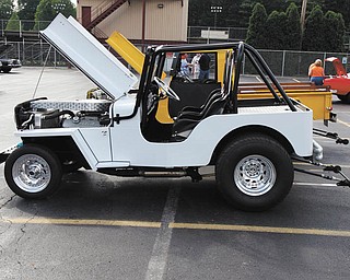 The stats on this Jeep owned by John Stevens of Poland are: white 1953 CJ3B Jeep Pro street 2WD, 408cid Chevy w/factory alum. heads, Turbo 400, Ford 9Ó/4 Link. The hand-built body and frame were a combined effort of Clarence, Don and John Stevens.