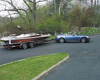 Bill Maine of Boardman says, "When it gets too hot to ride around in my customized 2006 Cadillac XLR, powered by a 320 HP Northstar engine, I pull up to the nearest lake and back the wheels behind me in and go for a ride in my Customized 21ft Cheyenne daycruiser powered by a 572 cu in 700 HP Chevy at 85 MPH."