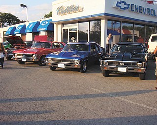 The red 1972 Chevy Nova belonging to Don E. Ardale of Boardman and blue 1968 Chevy Nova belonging to Ralph C. Ford of Canfield are pictured at the Chevy dealership in Salem..