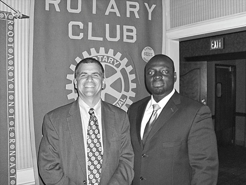 Lives reconstructed: After traveling to Ghana with five surgical nurse volunteers to perform reconstructive surgeries and to teach local doctors the procedures, Dr. Michael K. Obeng, at right, a plastic surgeon at St. Elizabeth Boardman Health Center, spoke of his experiences during a meeting of Youngstown Rotary Club. Obeng, also the founder and CEO of R.E.S.T.O.R.E. Worldwide Inc., told how the reconstructive procedures helped the poor with congenital or accidental deformities, who were shunned by families and the public, to become contributing citizens of Ghana. Obeng holds academic appointments at several institutions, including NEOCOM at Rootstown and the University of Pittsburgh. Sharing a moment with the speaker is Steve Kristen, Rotary Club president.