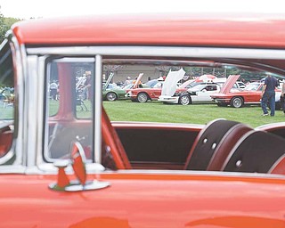 LISA-ANN ISHIHARA | THE VINDICATOR..Cars pack into Boardman Park for the Mahoning Valley Olde Car Club car show. John Sylvester of Boardman brought his 1957 Bel Air, front.