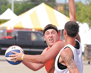 Mark Seger of Cortland Ohio is about to put up a shot over Phil Monfoletto of Buffalo New York.