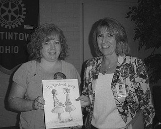 College course explained: Austintown Rotary learned the benefits of attending a community college during a recent meeting. Presenting the informative talk was, at right, Terry Shifflet of Eastern Gateway Community College, a fully accredited two-year associate degree college that enables students to obtain a degree in more than 60 majors that will transfer or qualify for the job market or certificate programs. The admissions department can schedule an appointment for a tour of one of the six locations closest to the student. To arrange for a tour call the valley center at 330-884-0860. A brochure released by the college is displayed by, at left, Susan Leetch, Rotary president.