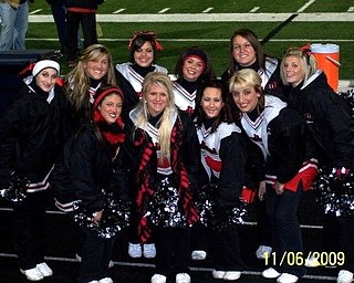 Canfield Varsity cheerleaders pose before their 1st playoff win against Aurora!!!