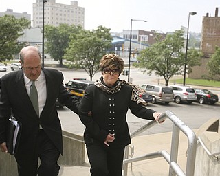 ROBERT K. YOSAY | THE VINDICATOR...ROBERT K. YOSAY | THE VINDICATOR ..Flora Cafaro with her attorney William Doyle walks up the stairs to the Mahoning County Justice Center to be booked after being indicted by a grand Jury - he was joined by Michael Sciortino, John McNally IV and ,Marty Yavorcik .-30-...-30-
